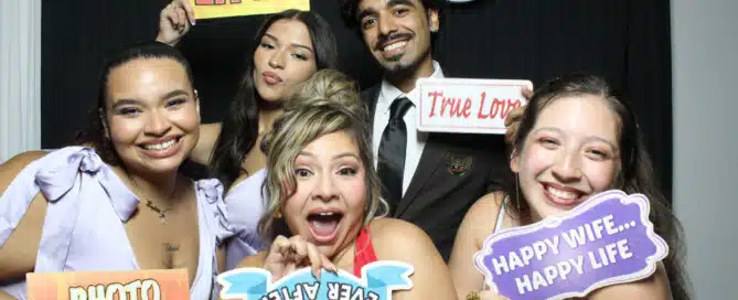 Wedding guests enjoying a photo booth at an NYC wedding