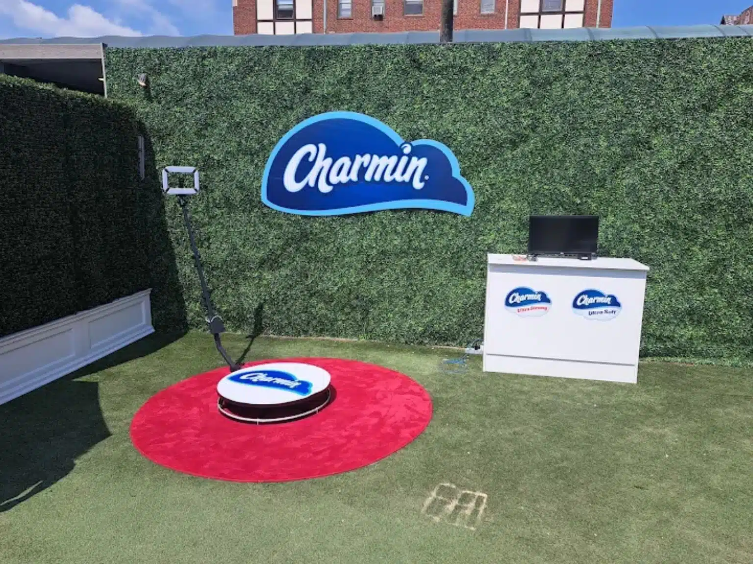 Magic Smiles 360 photo booth platform and custom branded setup at a Charmin corporate event